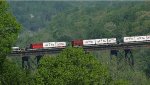 Wagons on 85-foot flats cross the James River